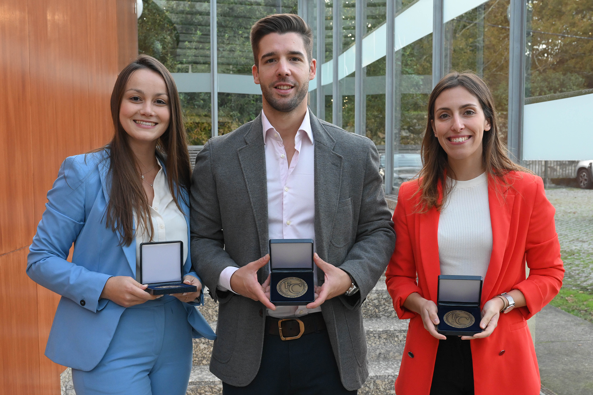 Students receive medals for completing their doctor degrees