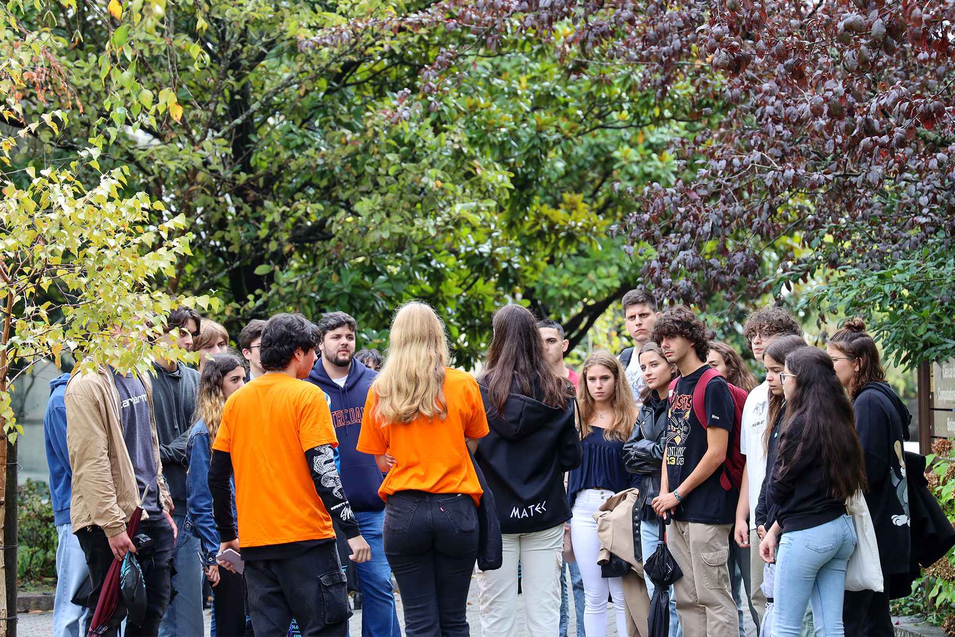 group of students talking happily on the campus of the Faculty of Sciences of the University of Porto