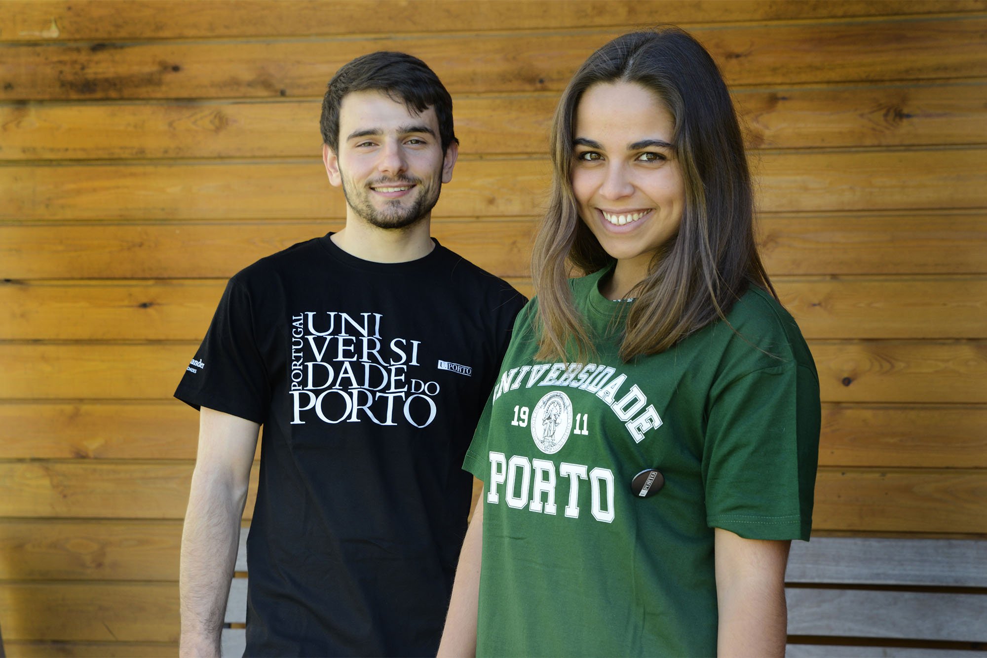Two students wearing the U.Porto shirts
